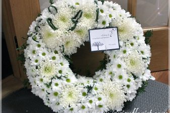White funeral wreath with mums