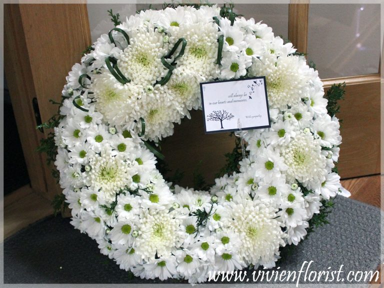 White funeral wreath with mums