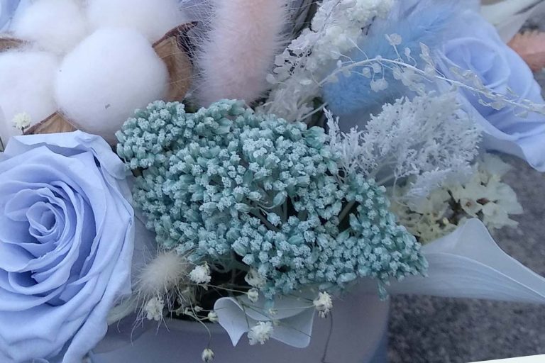 Light blue and pink preserved flower arrangement