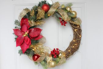 Glamorous red poinsettia golden wreath